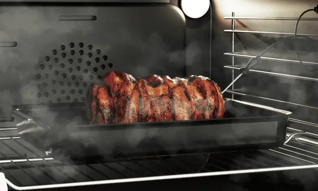 Soczysta pieczeń w dymie, pieczona w piekarniku z termometrem. Grill w piekarniku daje idealnie przypieczone żeberka.
